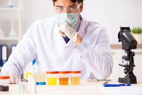 photo of chemical researcher with protection glasses