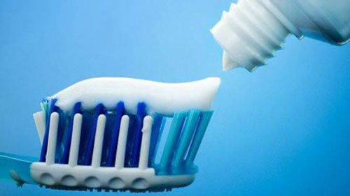 photo of using toothpaste